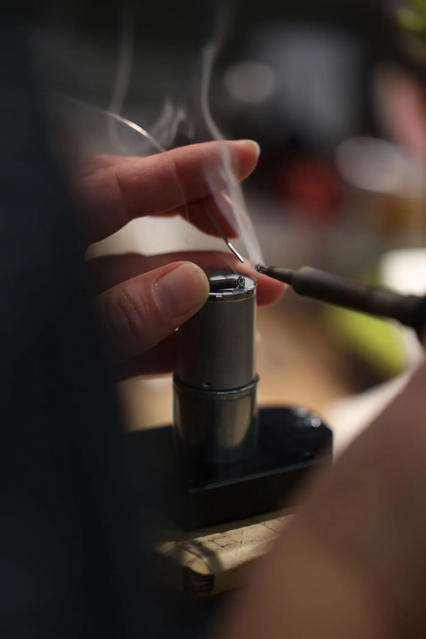 Bench Source technician assembling an annealer torch assembly by hand